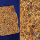 Illustration for article titled 30 Starry Wonders Hiding Inside of Dull Meteorites